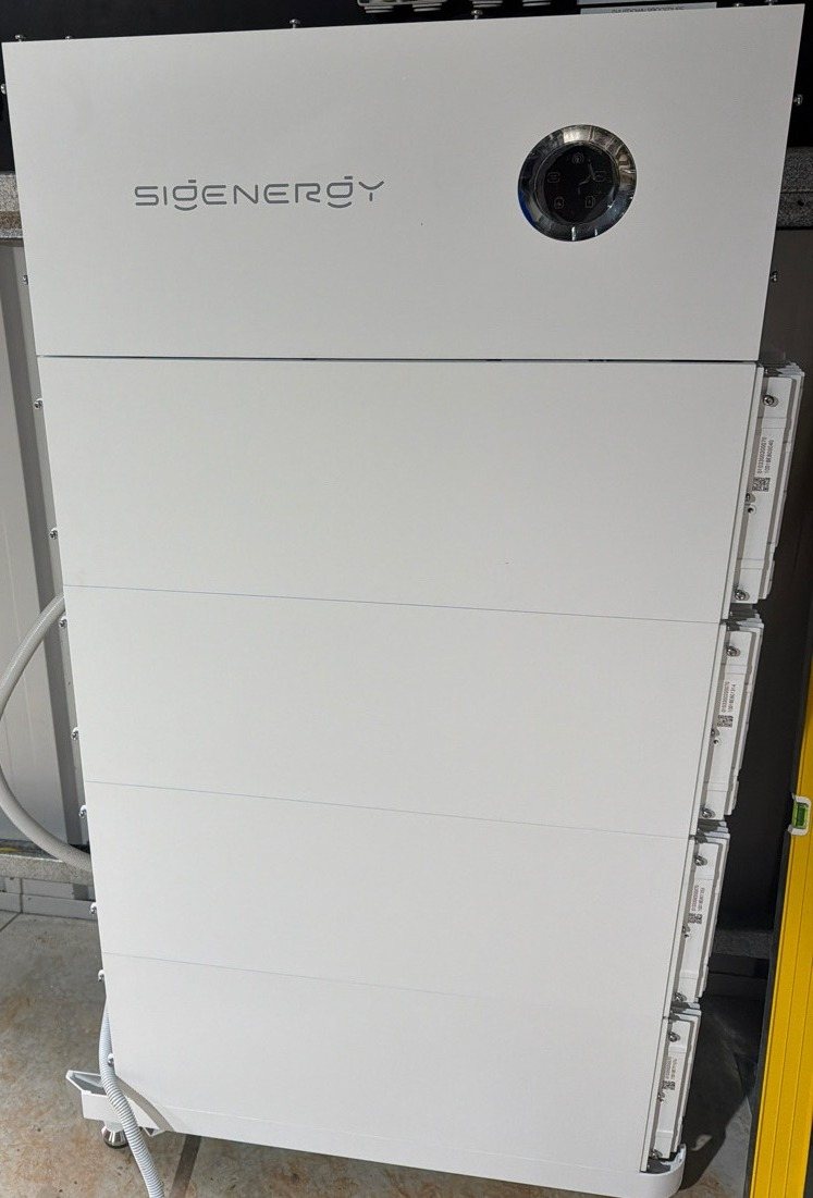 Sigenergy SigenStor battery with four modules Sigenergy SigenStor battery with four modules, about 32 kWh, against a shed wall in Alstonville, installed by Sun Connect Solar
