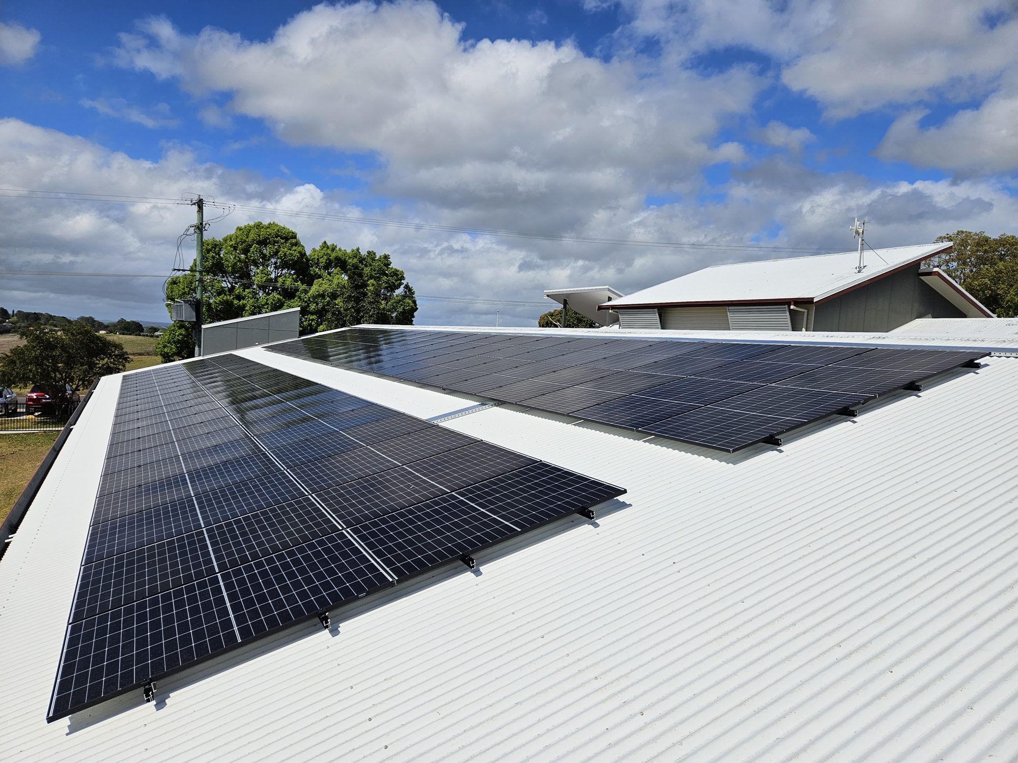Commercial solar panels on a large Colorbond roof in the Northern Rivers NSW, installed by Sun Connect Solar