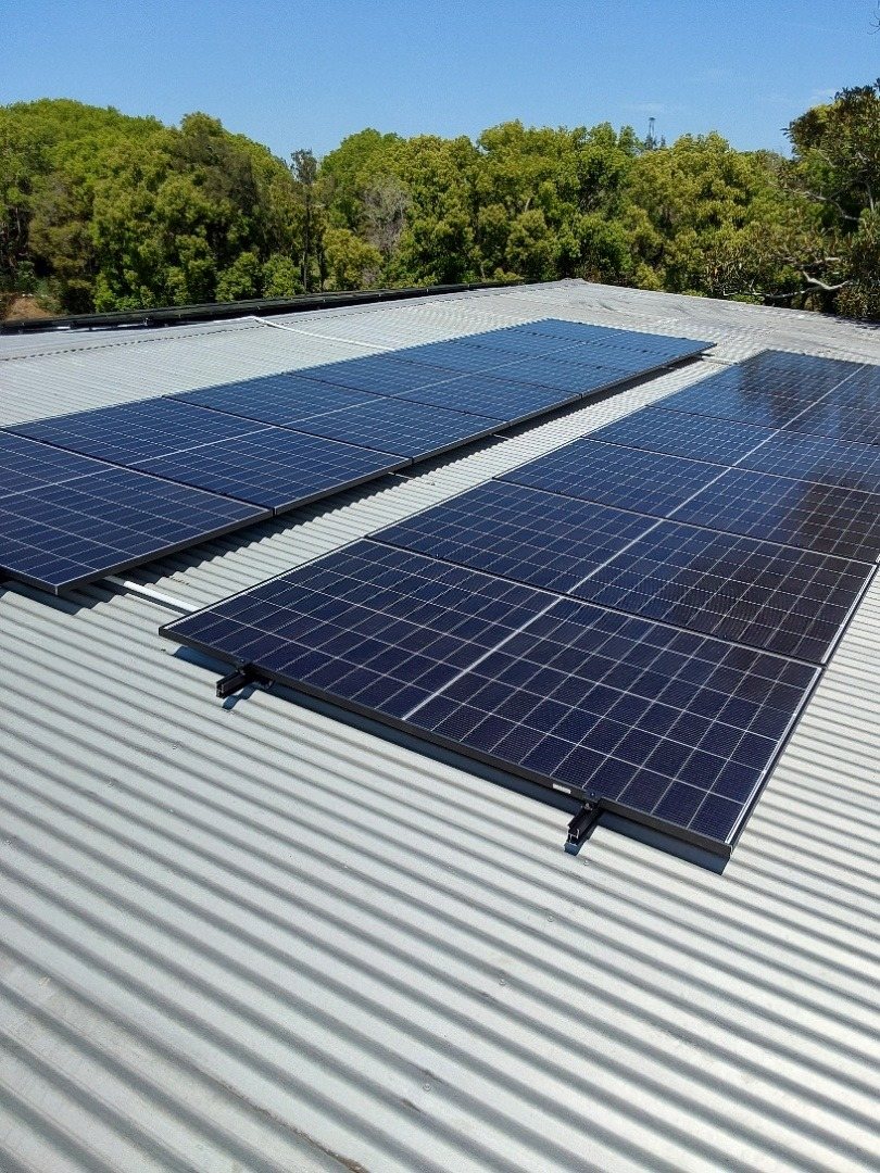 Two long rows of Jinko solar panels on a galvanised roof at a rural home in the Coraki area Two long rows of Jinko solar panels on a galvanised roof at a rural home in the Coraki area, part of a 13.3 kW three-phase install by Sun Connect Solar