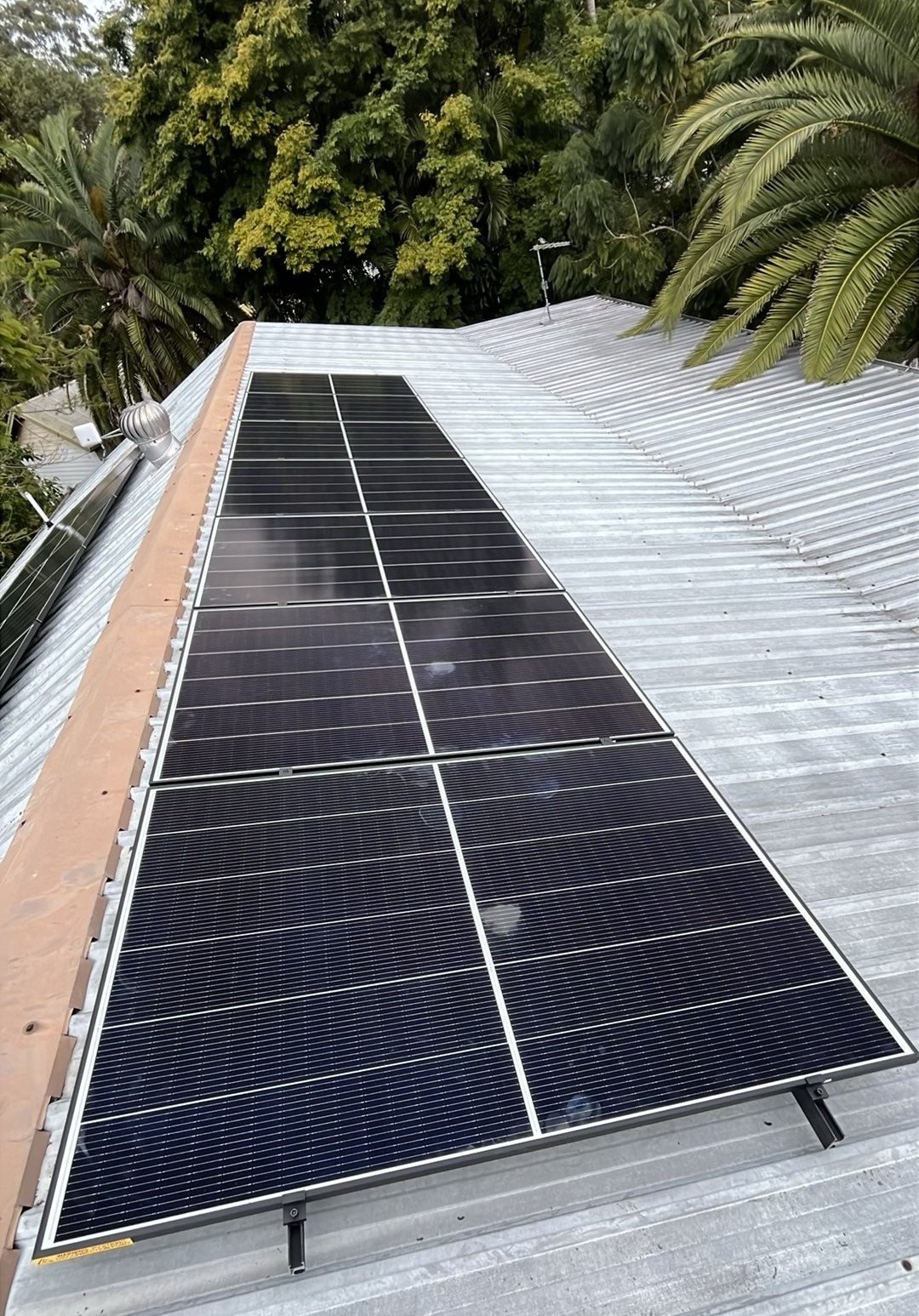 Close-up of a Jinko solar array on a corrugated roof in Dunoon Close-up of a Jinko solar array on a corrugated roof in Dunoon, north of Lismore, installed by Sun Connect Solar