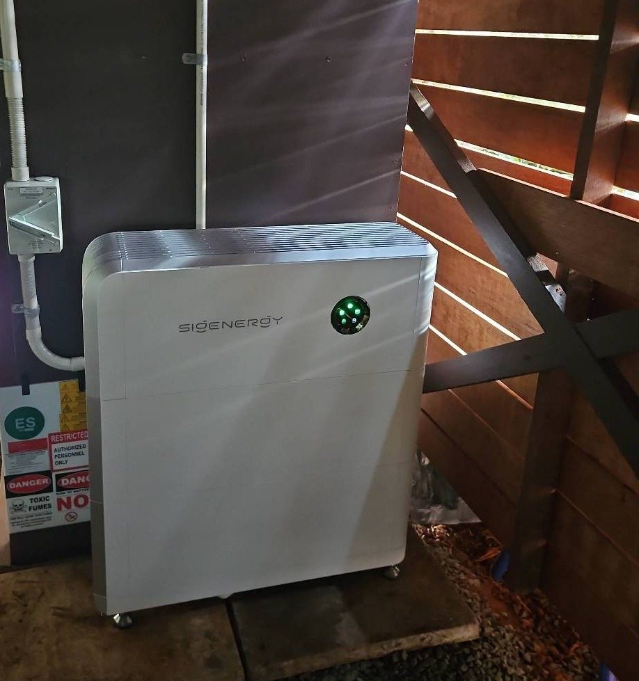 Sigenergy SigenStor 16 kWh battery on pavers in a sheltered timber-slatted area at a Dunoon home Sigenergy SigenStor 16 kWh battery on pavers in a sheltered timber-slatted area at a Dunoon home, installed by Sun Connect Solar