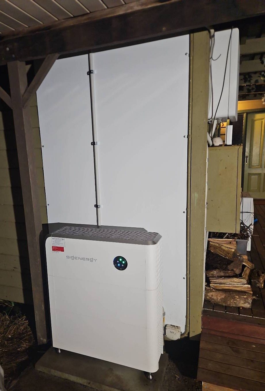 Sigenergy SigenStor 16 kWh battery on a concrete base under the verandah of an old weatherboard home at Federal Sigenergy SigenStor 16 kWh battery on a concrete base under the verandah of an old weatherboard home at Federal, installed by Sun Connect Solar