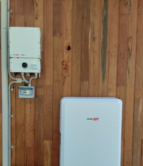 SolarEdge inverter and SolarEdge home battery on a timber-clad wall at Goonengerry, installed by Sun Connect Solar