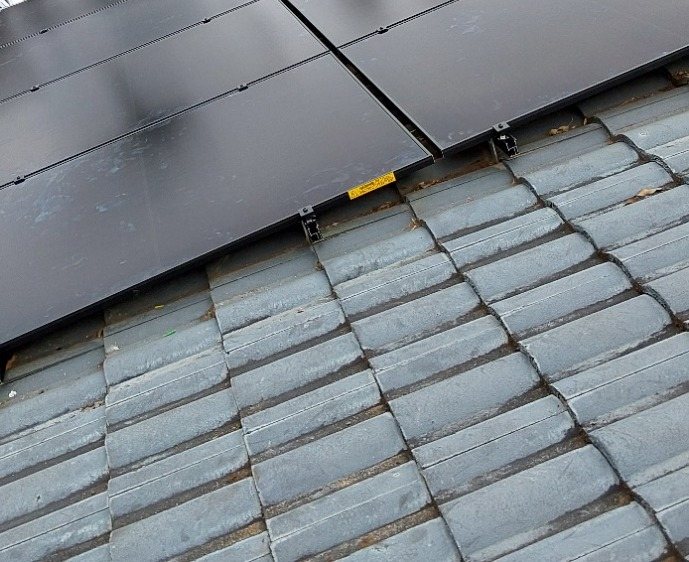 All-black AIKO solar panels on a grey concrete tile roof in Lennox Head All-black AIKO solar panels on a grey concrete tile roof in Lennox Head, installed by Sun Connect Solar