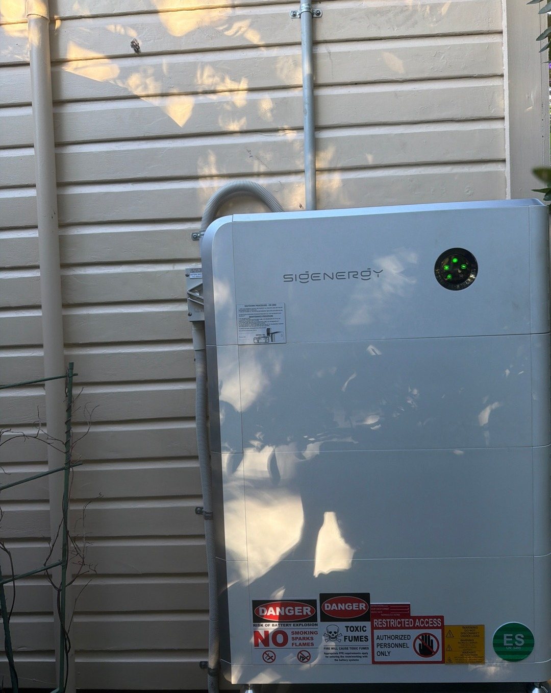 Sigenergy SigenStor 24 kWh battery on the weatherboard wall of a Mullumbimby home Sigenergy SigenStor 24 kWh battery on the weatherboard wall of a Mullumbimby home, in dappled afternoon light, installed by Sun Connect Solar
