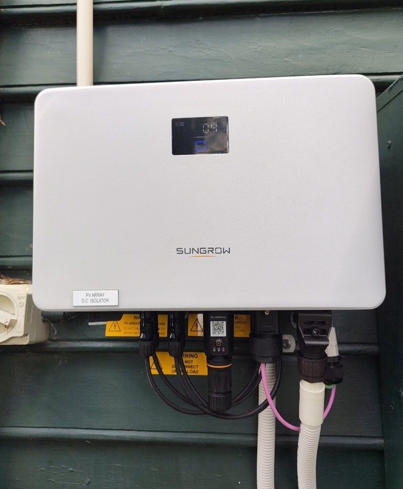 Sungrow 5 kW solar inverter on a dark green weatherboard wall in Murwillumbah Sungrow 5 kW solar inverter on a dark green weatherboard wall in Murwillumbah, part of a 6.65 kW AIKO solar install by Sun Connect Solar