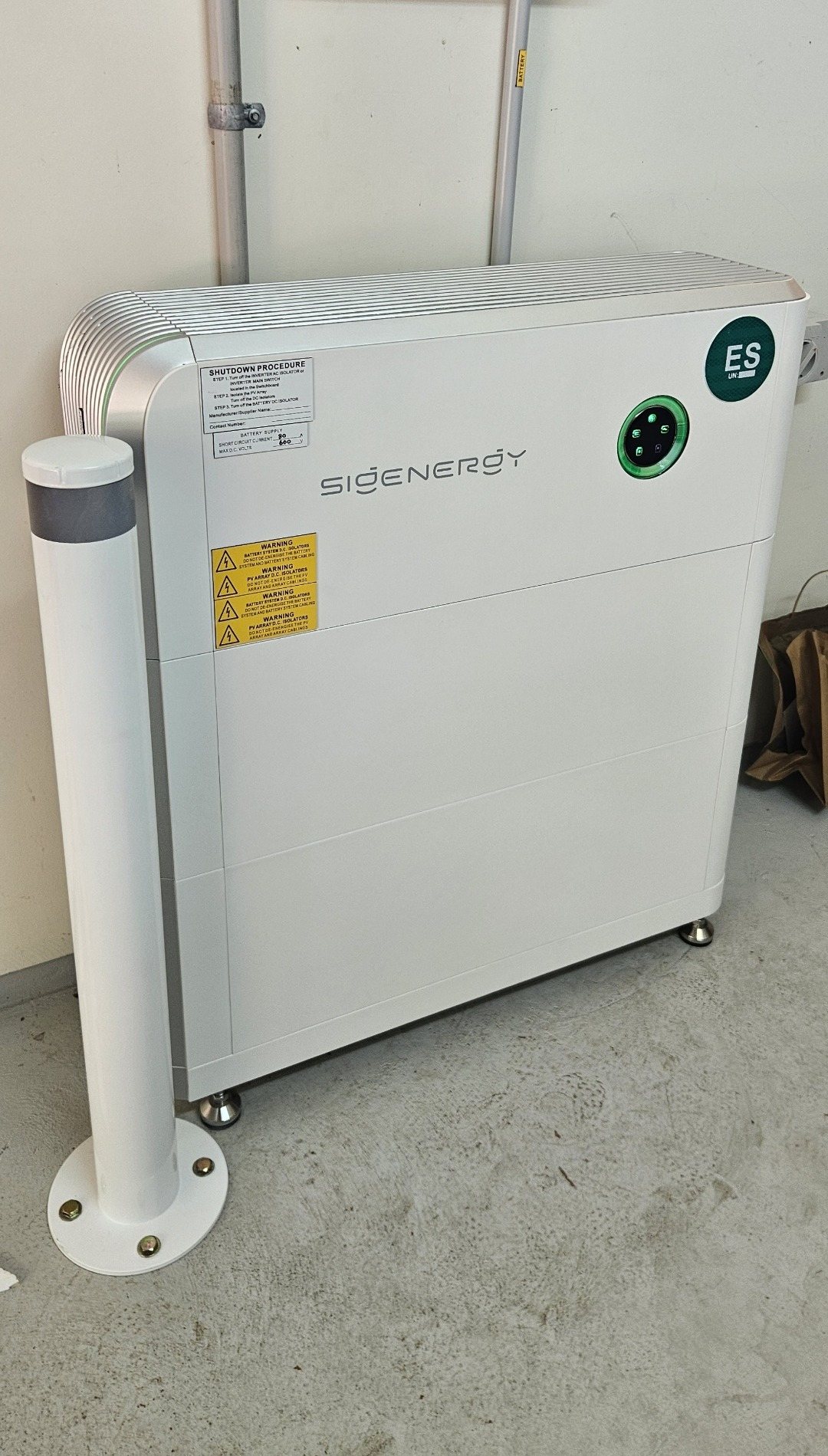 Sigenergy SigenStor 16 kWh battery with a protective bollard in a garage in Ocean Shores Sigenergy SigenStor 16 kWh battery with a protective bollard in a garage in Ocean Shores, installed by Sun Connect Solar