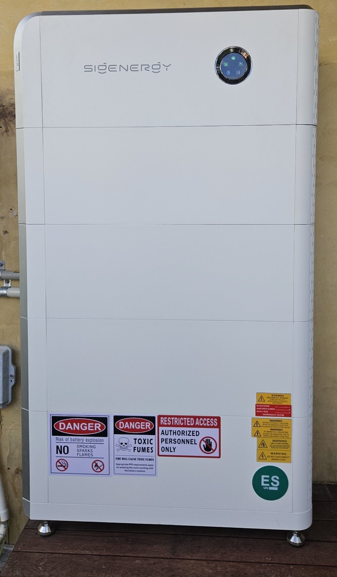 Sigenergy SigenStor 32 kWh battery on a timber deck against a rendered wall in Ocean Shores Sigenergy SigenStor 32 kWh battery on a timber deck against a rendered wall in Ocean Shores, installed by Sun Connect Solar