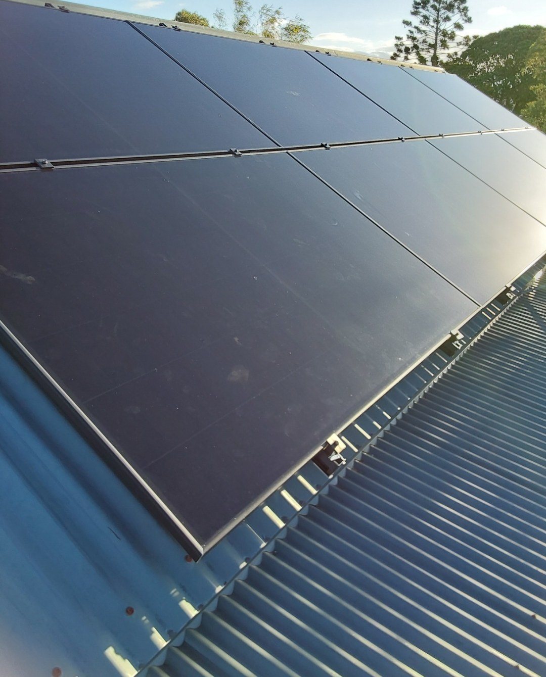 Close-up of an AIKO solar array on Colorbond roofing in Pottsville Close-up of an AIKO solar array on Colorbond roofing in Pottsville, Tweed Coast, by Sun Connect Solar