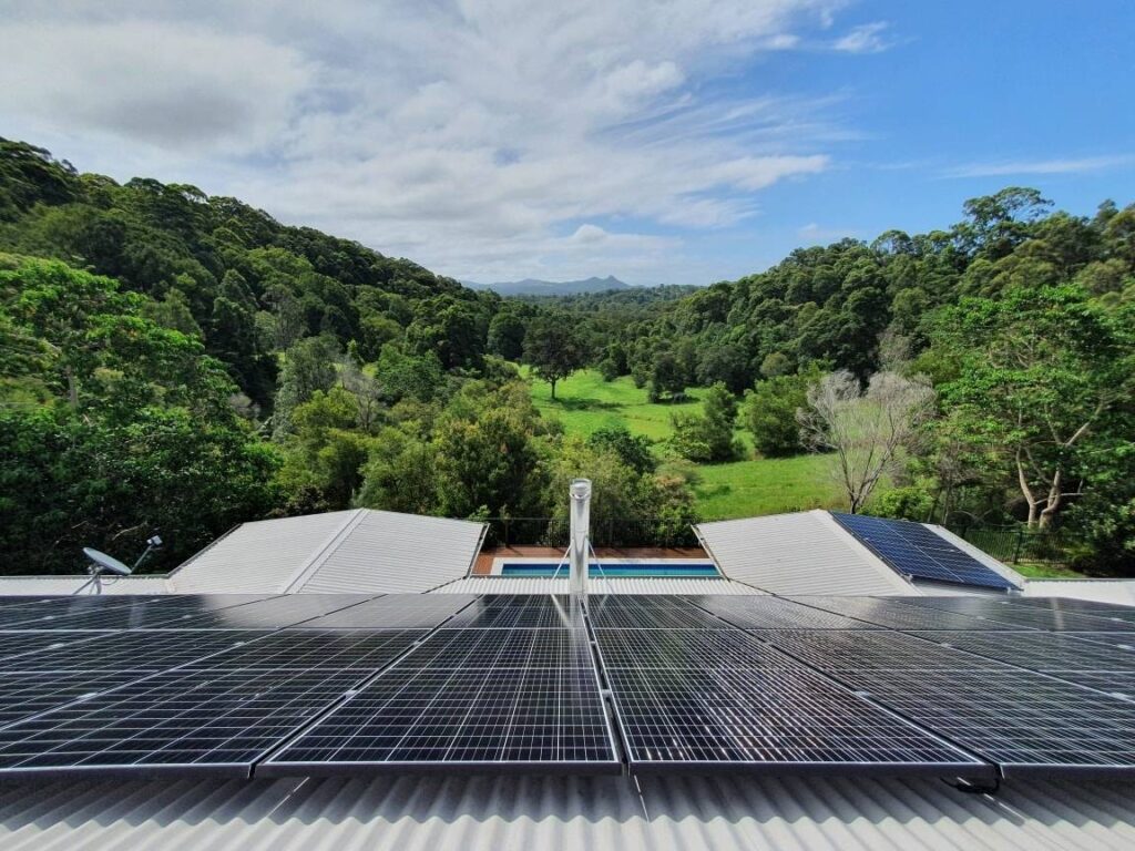 Rooftop solar panels on a home overlooking a green hinterland valley in the Northern Rivers NSW, Sun Connect Solar