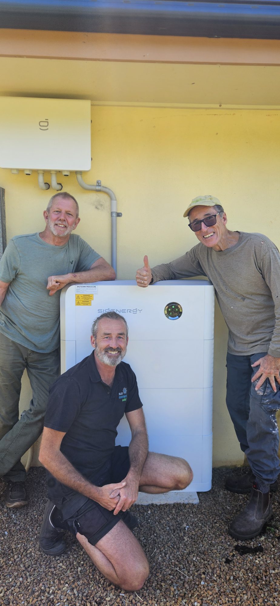 Greg and Jeff with their Sigenergy battery in Alstonville