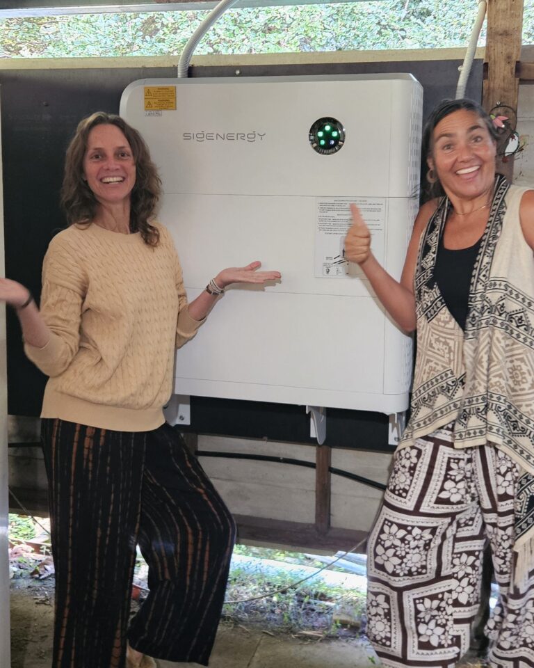 Sarah-Jane and Jewelli with their new Sigenergy battery in Wilsons Creek