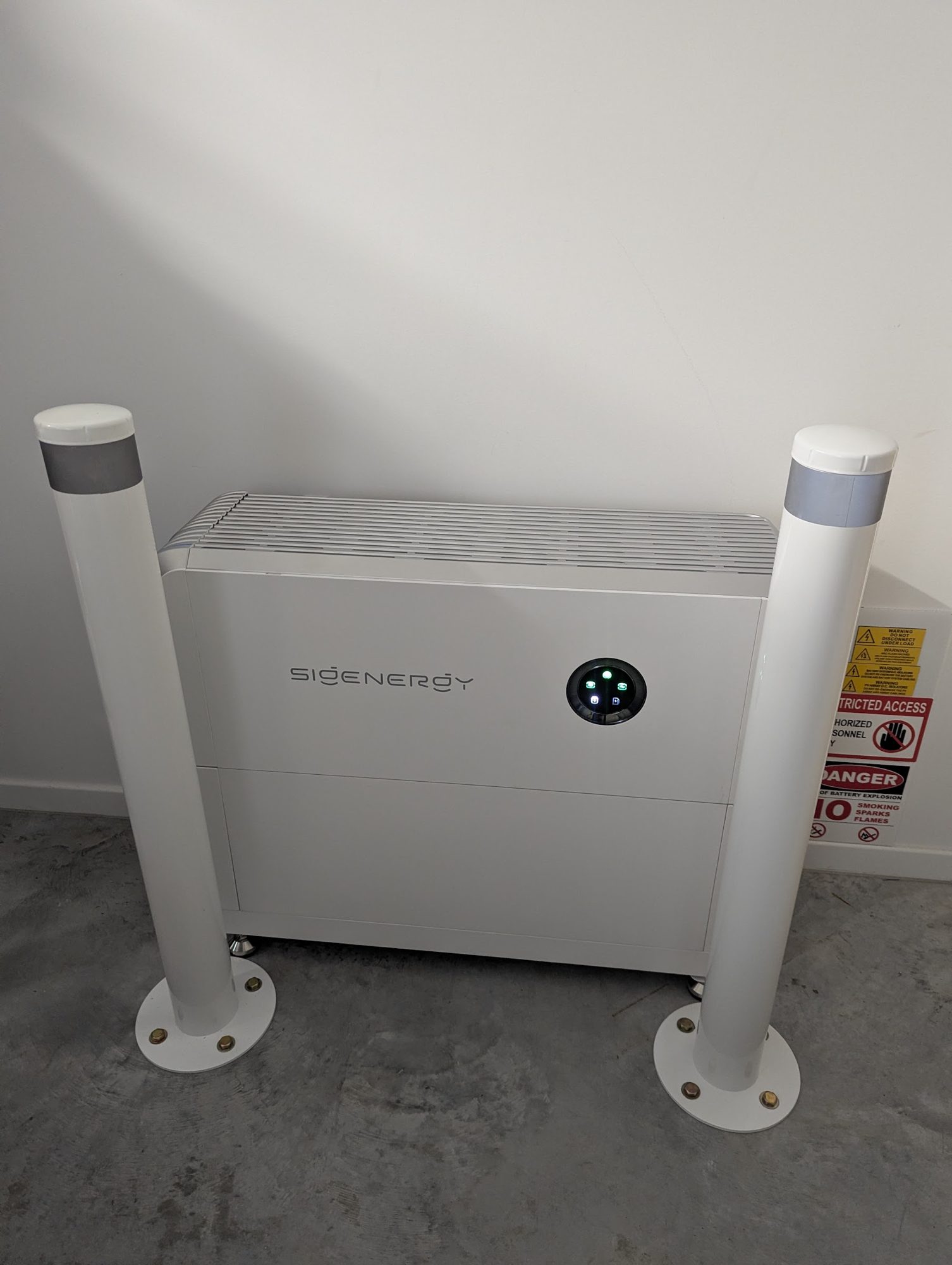 Sigenergy SigenStor battery protected by two white bollards, Mullumbimby install by Sun Connect Solar